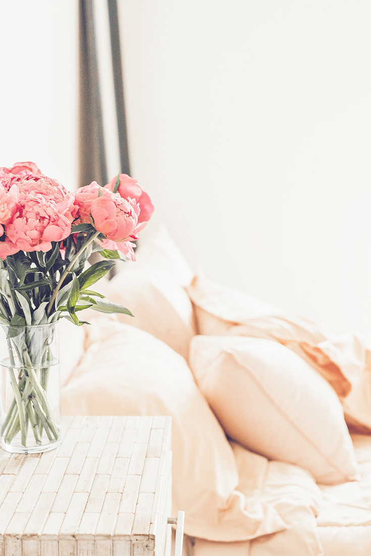 Pink flowers on bedside table - blog post about how to deal with uncertainty